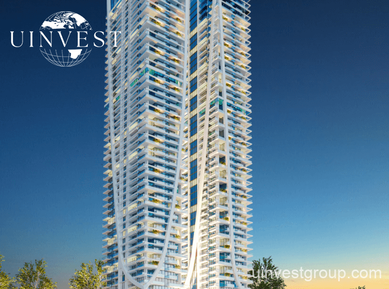 Elitz 2 twin glass towers with landscaped forecourt under a clear blue sky in Jumeirah Village Circle, Dubai.