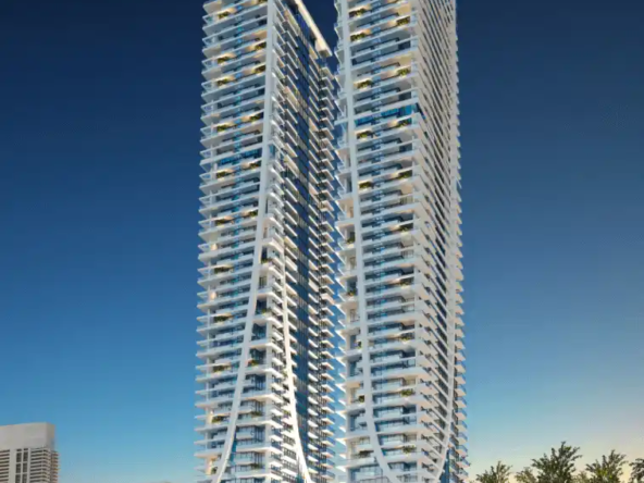 Elitz 2 twin glass towers with landscaped forecourt under a clear blue sky in Jumeirah Village Circle, Dubai.
