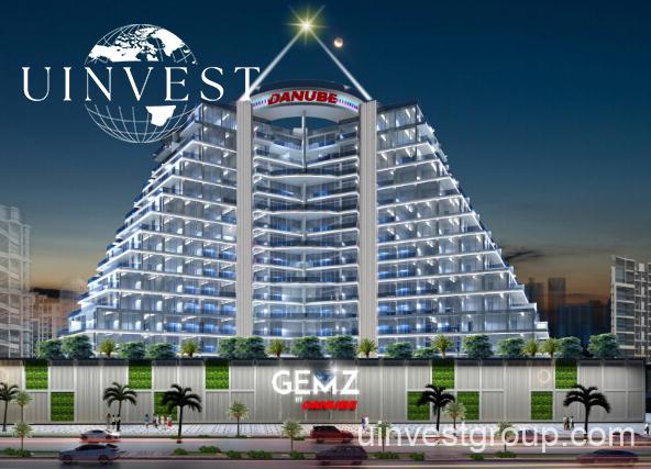 Gemz by Danube pyramid-inspired façade in Al Furjan, Dubai, under a clear blue sky