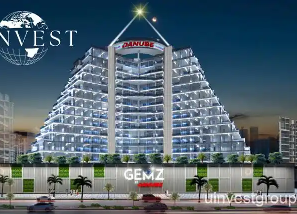 Gemz by Danube pyramid-inspired façade in Al Furjan, Dubai, under a clear blue sky