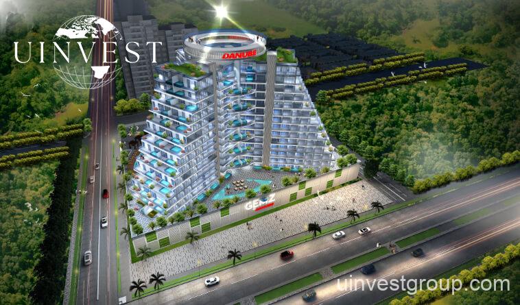 Gemz by Danube pyramid-inspired façade in Al Furjan, Dubai, under a clear blue sky
