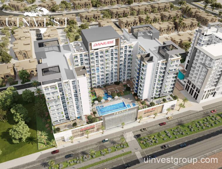 Architectural rendering of Pearlz by Danube’s 13-storey residential building in Al Furjan, Dubai, showcasing a clean contemporary façade, private balconies, infinity pool, landscaped podium gardens, water features, and a retail podium at street level