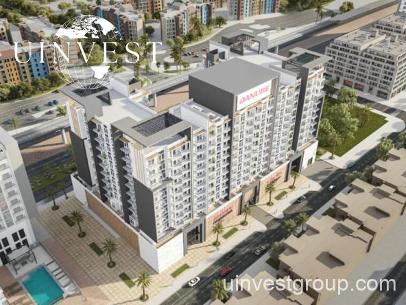 Architectural rendering of Pearlz by Danube’s 13-storey residential building in Al Furjan, Dubai, showcasing a clean contemporary façade, private balconies, infinity pool, landscaped podium gardens, water features, and a retail podium at street level