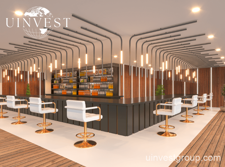 Spacious double-height lobby at Elitz 3 featuring modern seating, marble floors, and a concierge desk.