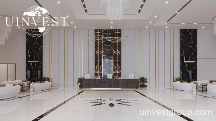 Elitz 3 twin glass towers with landscaped forecourt under a clear blue sky in Jumeirah Village Circle, Dubai.