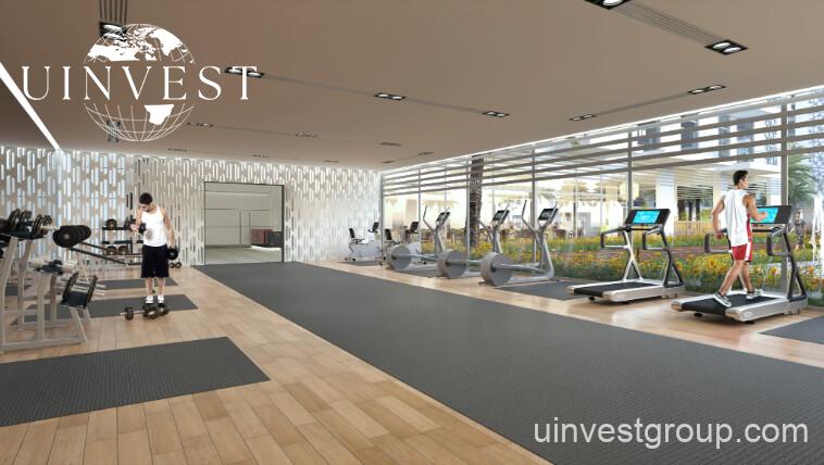 Open-plan studio apartment interior at Glitz by Danube featuring floor-to-ceiling windows