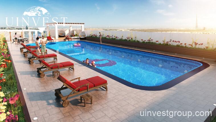 Open-plan studio apartment interior at Glitz by Danube featuring floor-to-ceiling windows