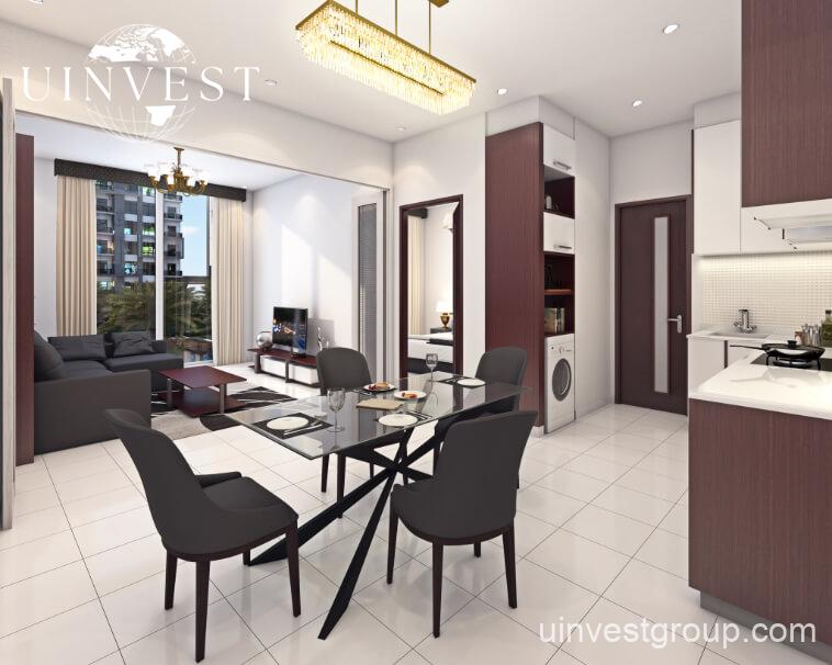 Exterior rendering of Lawnz by Danube Properties in Dubai International City, showing four eight-storey, country-themed freehold apartment buildings with pastel facades, geometric motifs, private balconies, surrounded by landscaped gardens, a community swimming pool, outdoor sports courts, and palm trees under a bright blue sky.