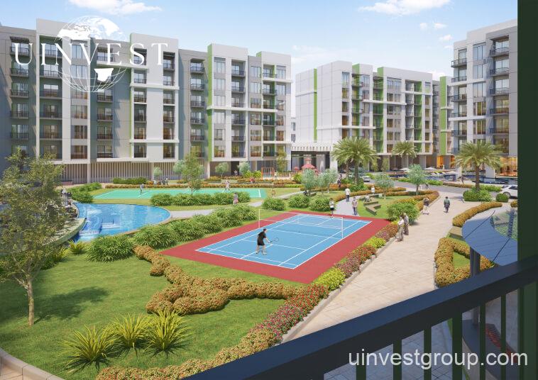 Rendering of Olivz by Danube’s modern residential towers in Al Warsan First, Dubai, featuring neutral-toned façades, landscaped gardens, water features, and swimming pools.