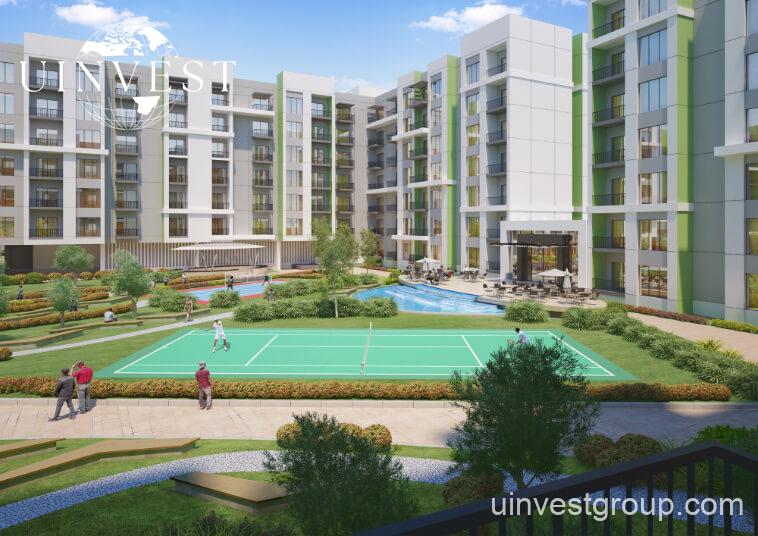 Rendering of Olivz by Danube’s modern residential towers in Al Warsan First, Dubai, featuring neutral-toned façades, landscaped gardens, water features, and swimming pools.