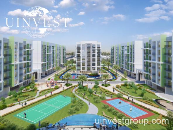 Rendering of Olivz by Danube’s modern residential towers in Al Warsan First, Dubai, featuring neutral-toned façades, landscaped gardens, water features, and swimming pools.