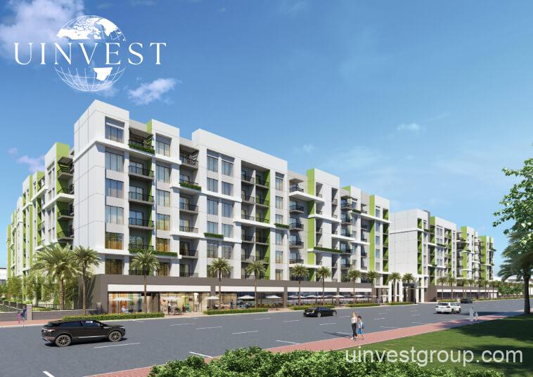 Rendering of Olivz by Danube’s modern residential towers in Al Warsan First, Dubai, featuring neutral-toned façades, landscaped gardens, water features, and swimming pools.