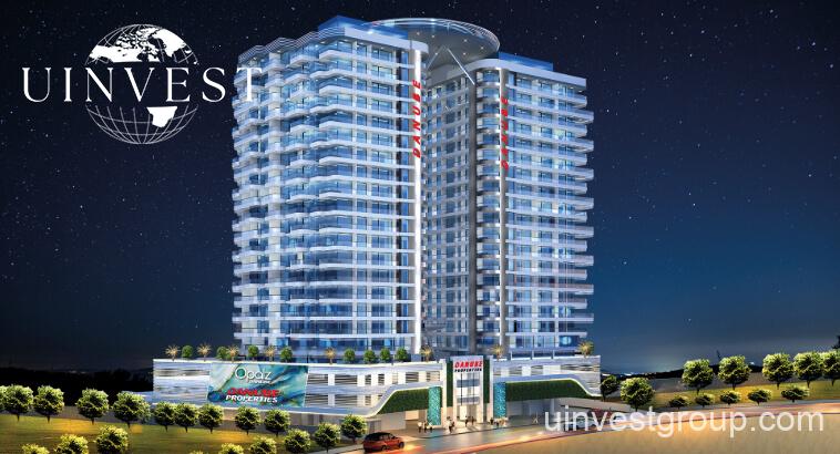 Architectural rendering of Opalz by Danube’s twin 19-storey residential towers in Arjan, Dubai, showcasing neutral-toned façades, private balconies overlooking landscaped water bodies, and integrated leisure facilities.