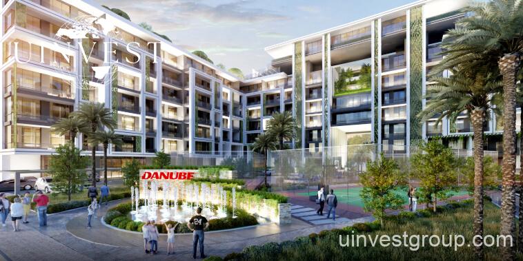 Rendering of Petalz by Danube in Al Warsan First, Dubai, showing modern mid-rise residential buildings with private pools, landscaped gardens, walking paths, outdoor cinema, eco-friendly features, and water bodies.