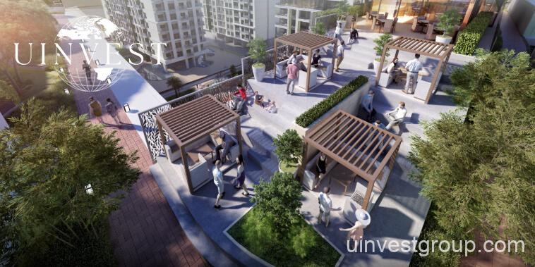Rendering of Petalz by Danube in Al Warsan First, Dubai, showing modern mid-rise residential buildings with private pools, landscaped gardens, walking paths, outdoor cinema, eco-friendly features, and water bodies.