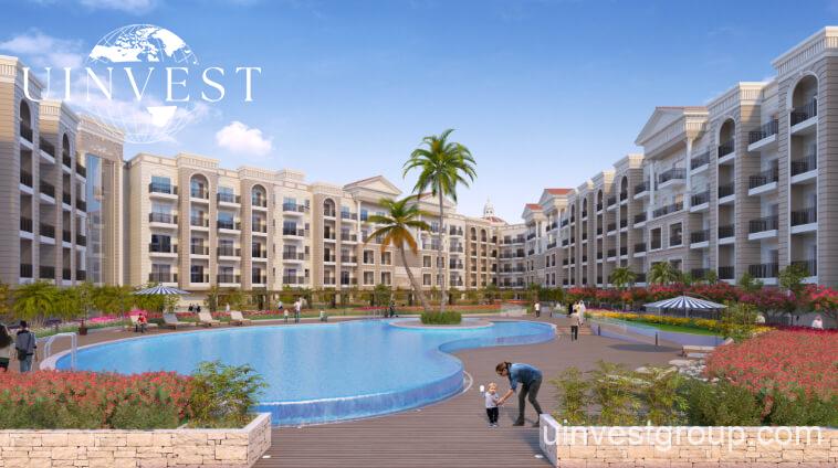 Residents enjoying a sunset swim in the infinity pool overlooking landscaped gardens at Resortz.