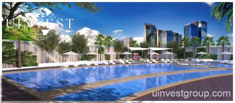 Gemz by Danube pyramid-inspired façade in Al Furjan, Dubai, under a clear blue sky