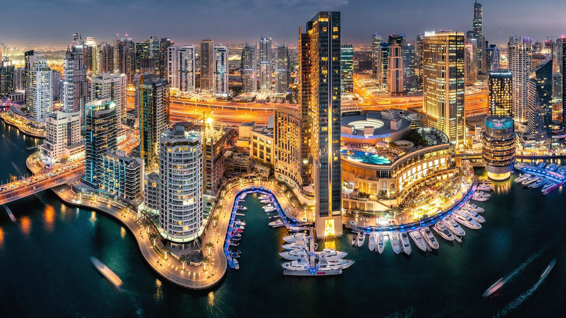 Dubai skyline at night - UAE Golden Visa and residency by investment with UInvest Group