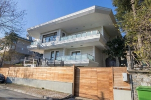 Elegant waterfront villa along the Bosphorus in Istanbul with traditional Ottoman architecture and serene sea views.