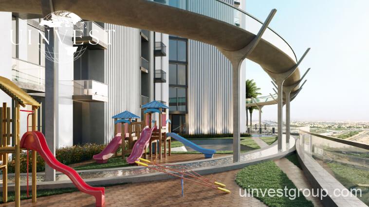 Exterior view of Skyz by Danube tower in Arjan, Dubailand, featuring terraced green sky gardens, open-air plazas, and Mediterranean-themed architecture.