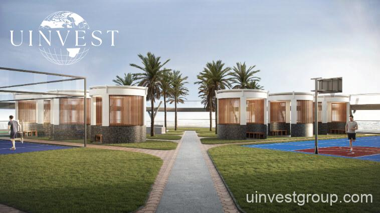 Exterior view of Skyz by Danube tower in Arjan, Dubailand, featuring terraced green sky gardens, open-air plazas, and Mediterranean-themed architecture.