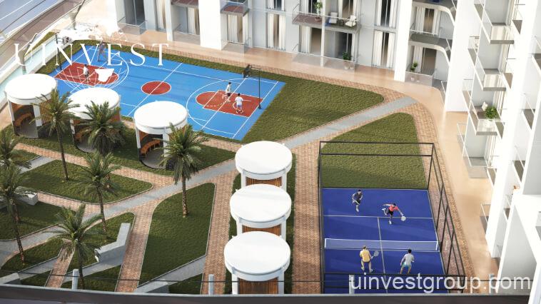 Exterior view of Skyz by Danube tower in Arjan, Dubailand, featuring terraced green sky gardens, open-air plazas, and Mediterranean-themed architecture.
