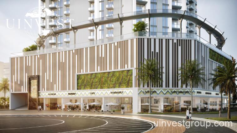 Exterior view of Skyz by Danube tower in Arjan, Dubailand, featuring terraced green sky gardens, open-air plazas, and Mediterranean-themed architecture.