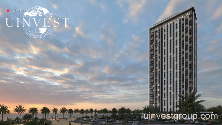 Modern high-rise tower of Delux Horizon Batumi with Black Sea in background