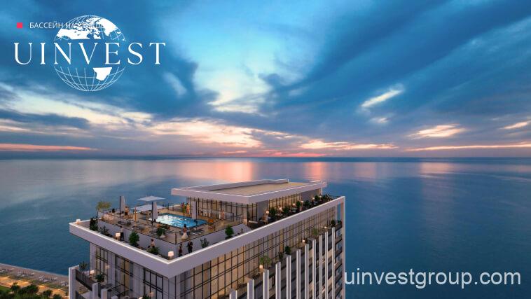 Modern high-rise tower of Delux Horizon Batumi with Black Sea in background
