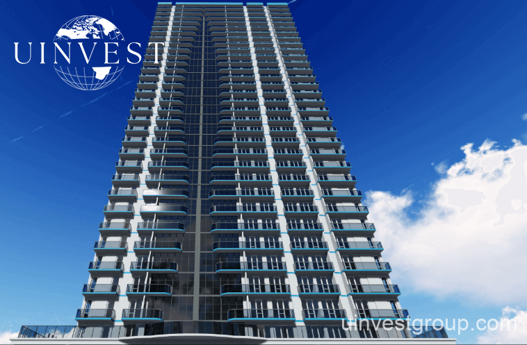 Wide-angle shot of Horizon Elegance Tower surrounded by palm trees and walking paths, a short walk from the Batumi coastline.