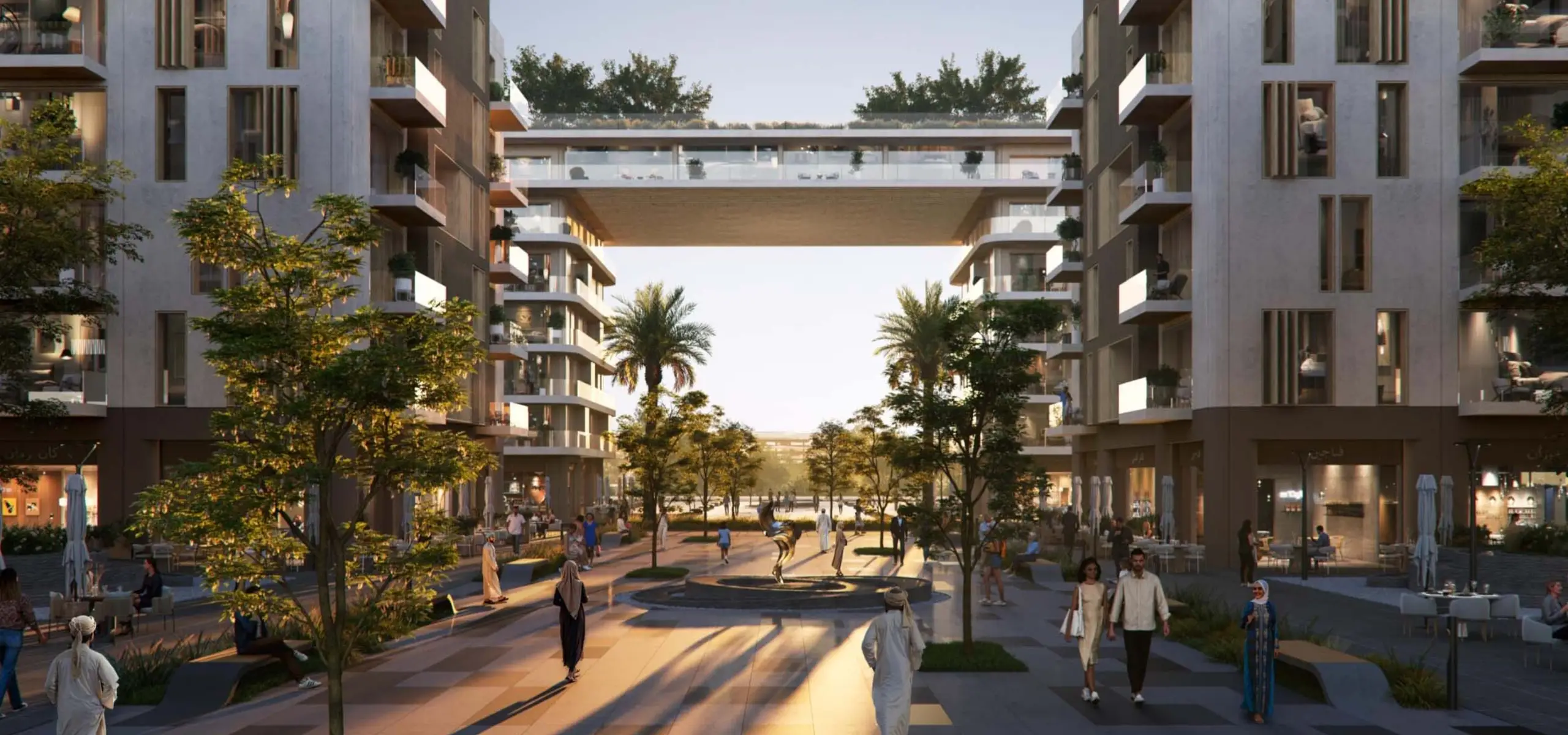 Tree-lined pedestrian boulevard at Wadi Zaha community, Sultan Haitham City