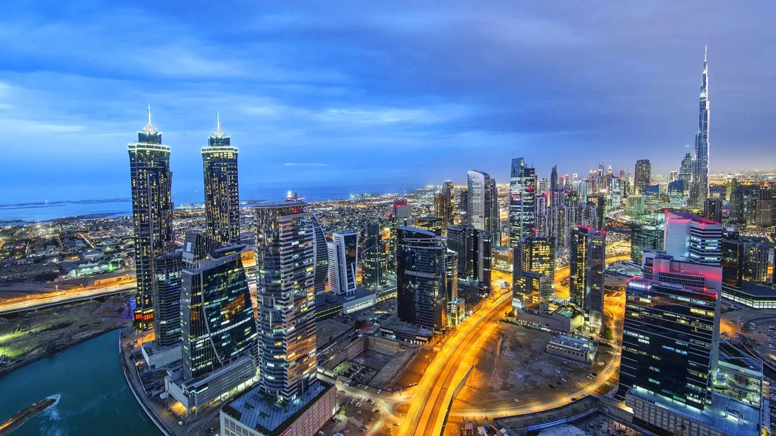 Business Bay and Downtown Dubai skyline at dusk with the Burj Khalifa, United Arab Emirates