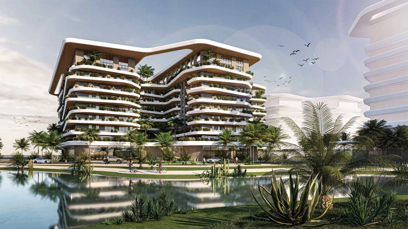 Uptown Muscat exterior view with landscaped lake, Knowledge Oasis, Oman