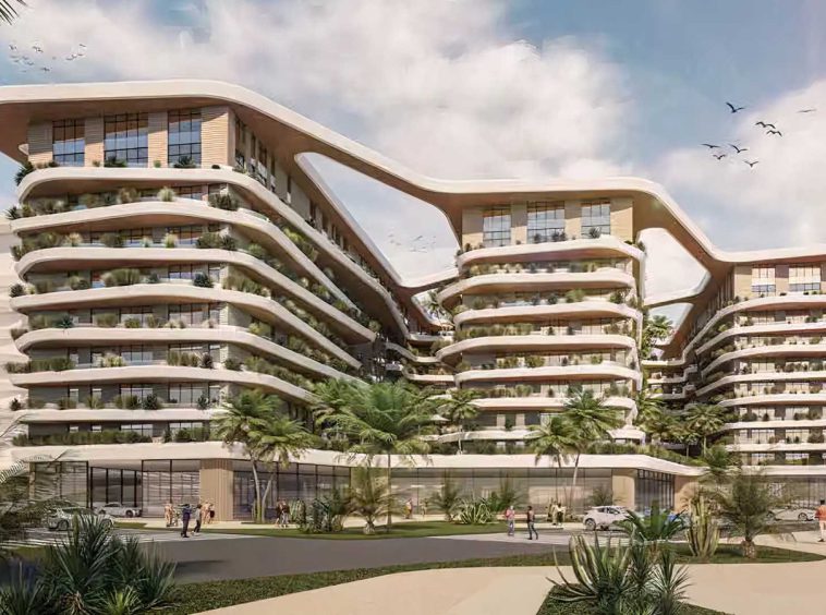 Uptown Muscat apartment buildings with curved white and beige facades