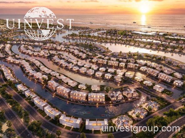 Aerial rendering of Lubana Island at Amazi, Hawana Salalah, showing waterfront villas and chalets around landscaped lagoons at sunset