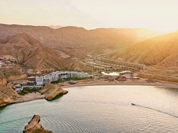 Aerial drone view of Muscat Bay at sunset