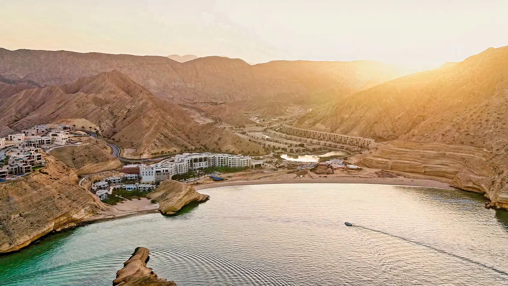 Aerial drone view of Muscat Bay at sunset