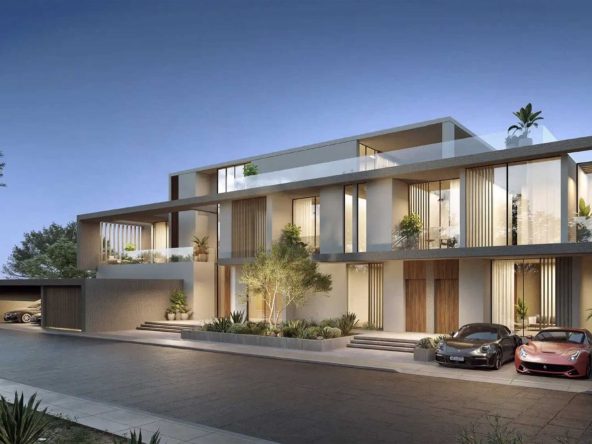 Villas at AIDA by DarGlobal on the Gulf of Oman coast at Yiti, with light stone facades and covered parking.