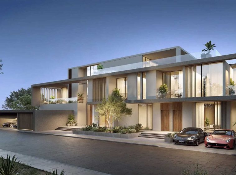 Villas at AIDA by DarGlobal on the Gulf of Oman coast at Yiti, with light stone facades and covered parking.