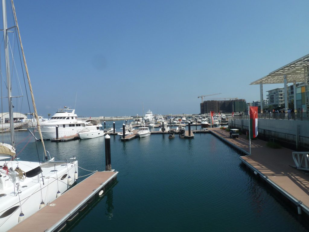 Al Mouj Marina waterfront with yachts and residences in Muscat, Oman