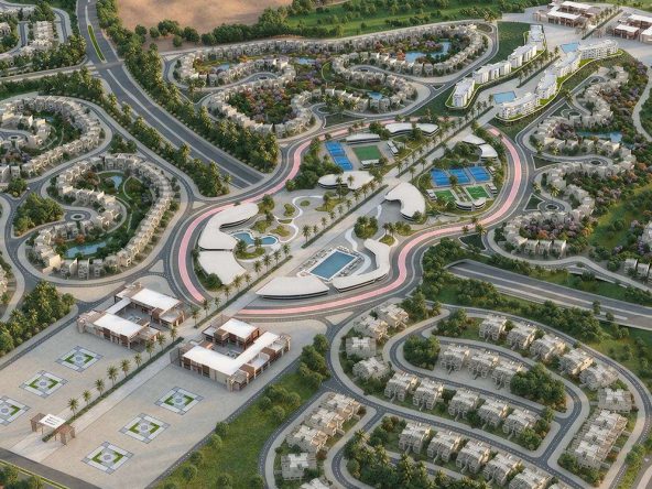 Aerial view of the Jood master plan in Sultan Haitham City, Muscat, showing villa neighbourhoods, pools and the central sports and social club.