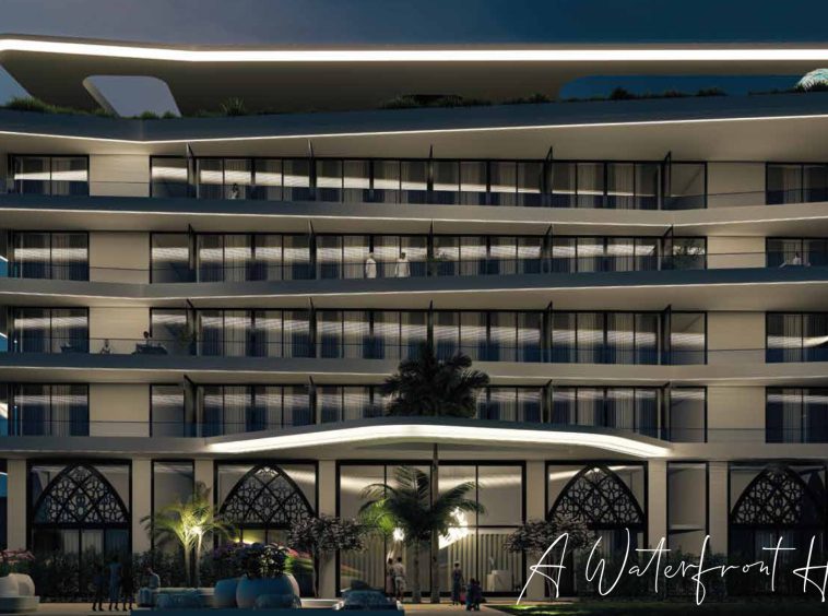The Sea Front Residences Taqah - illuminated facade at night