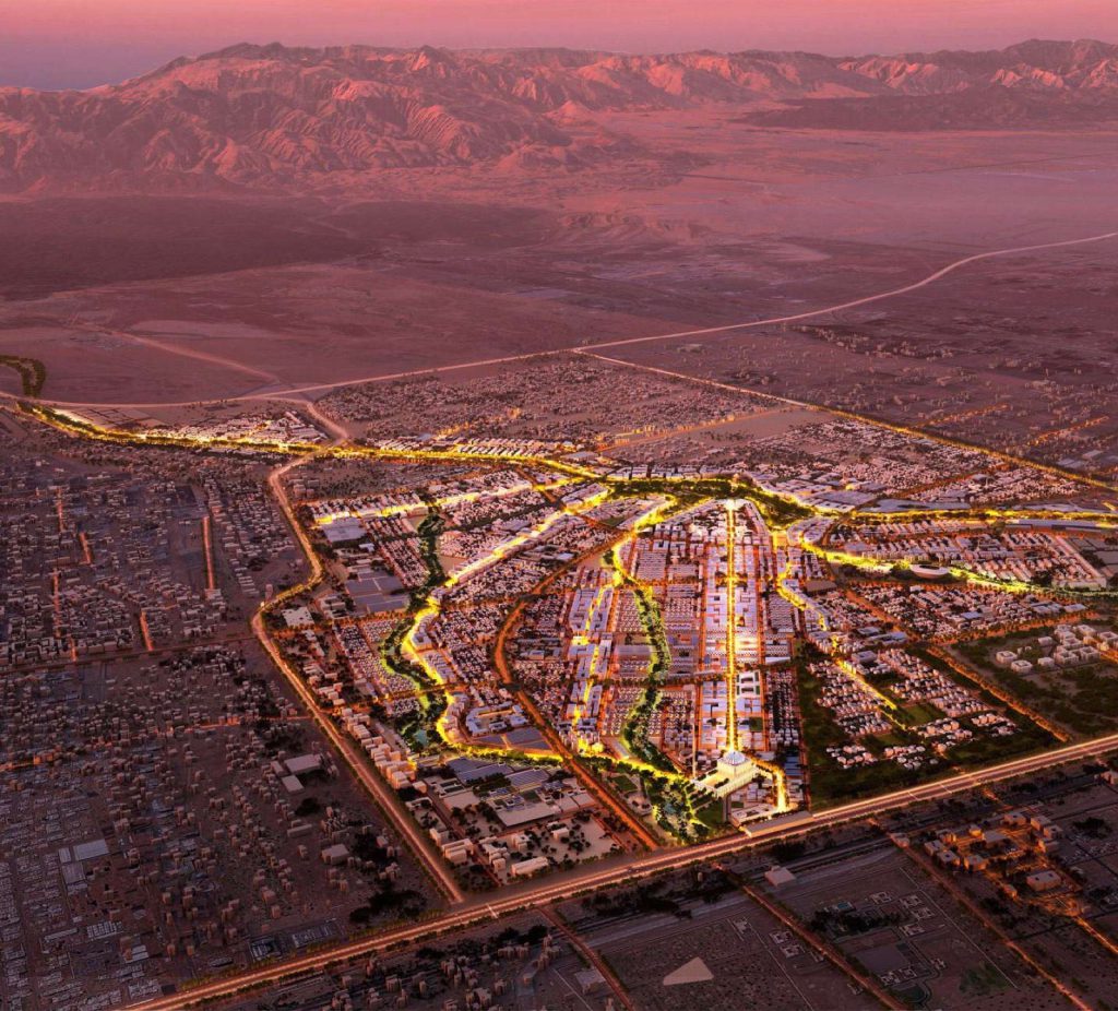Sultan Haitham City seen from the air at dusk, the new Muscat district built under Oman Vision 2040.