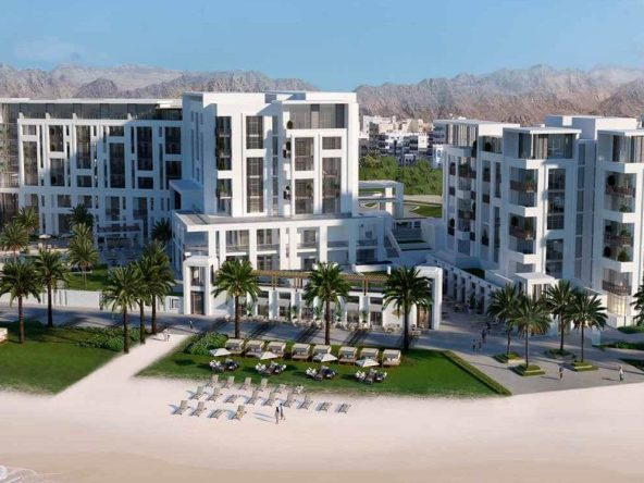 Aerial view of The Residences at Mandarin Oriental with Muscat mountains in the background