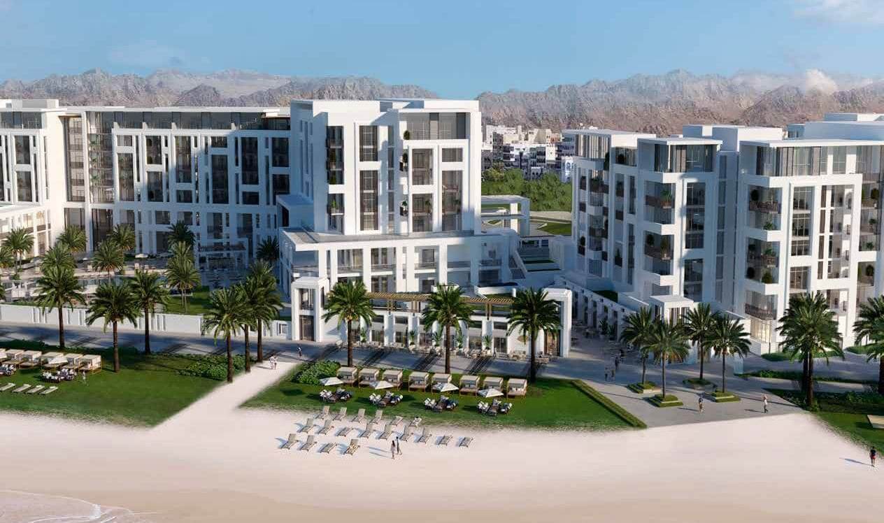 Aerial view of The Residences at Mandarin Oriental with Muscat mountains in the background