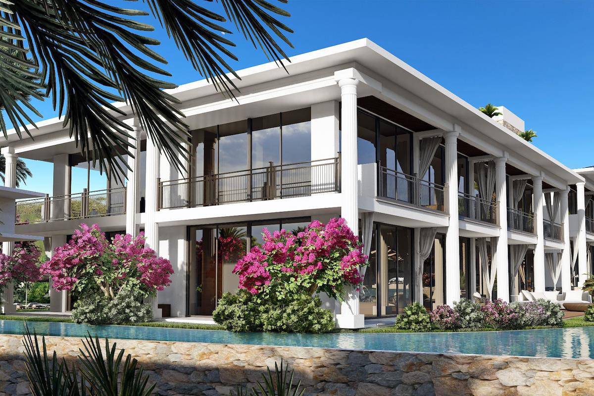 White two-storey Aloha homes with pink bougainvillea above a pool