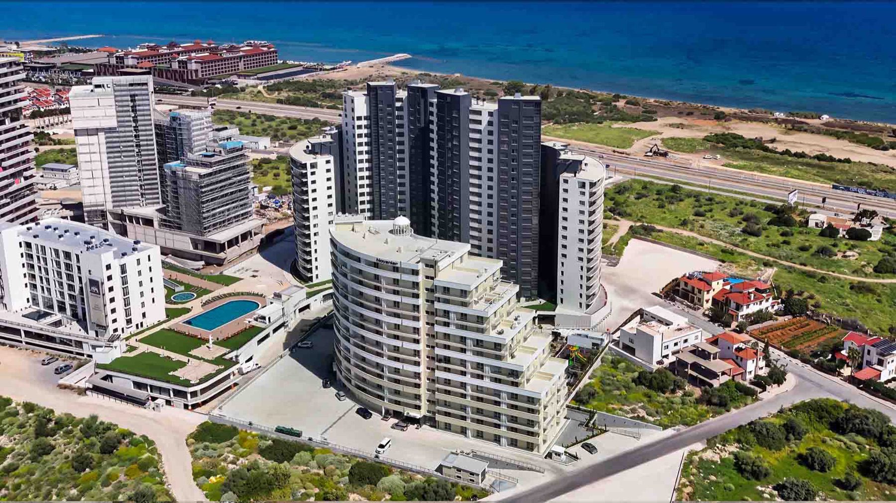 aerial view of the Bellagio curved block beside other towers near the sea