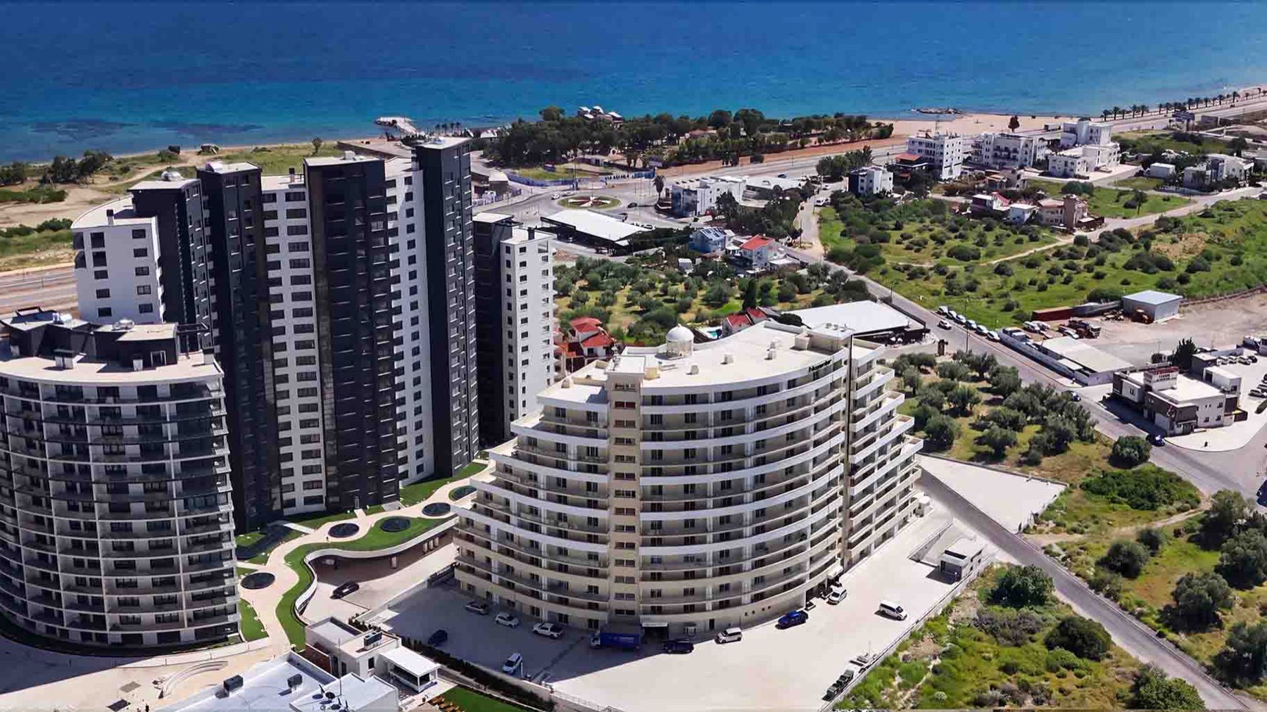 aerial view of the Bellagio curved building and nearby towers on the coast