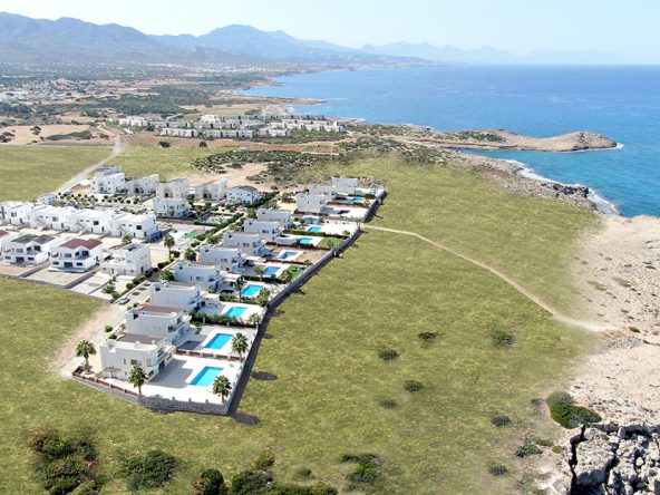 Aerial render of Caesar Bay villas with pools above the rocky coast