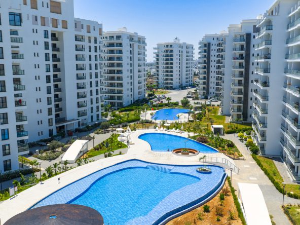 Aerial view of Caesar Blue apartment blocks and landscaped pools